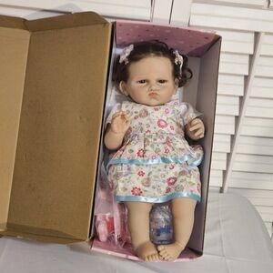 Reborn Baby With Floral Dress And  Brown Hair